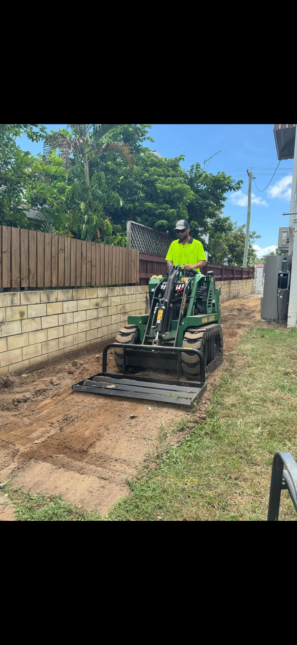 The G & T Hire team on a mini loader in Townsville