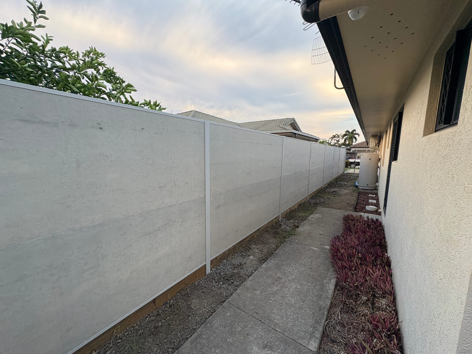 Colorbond fence down the side of a Townsville home
