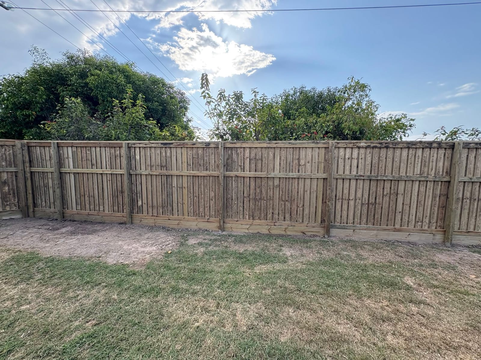 Acoustic timber fencing — lapped and capped, Townsville