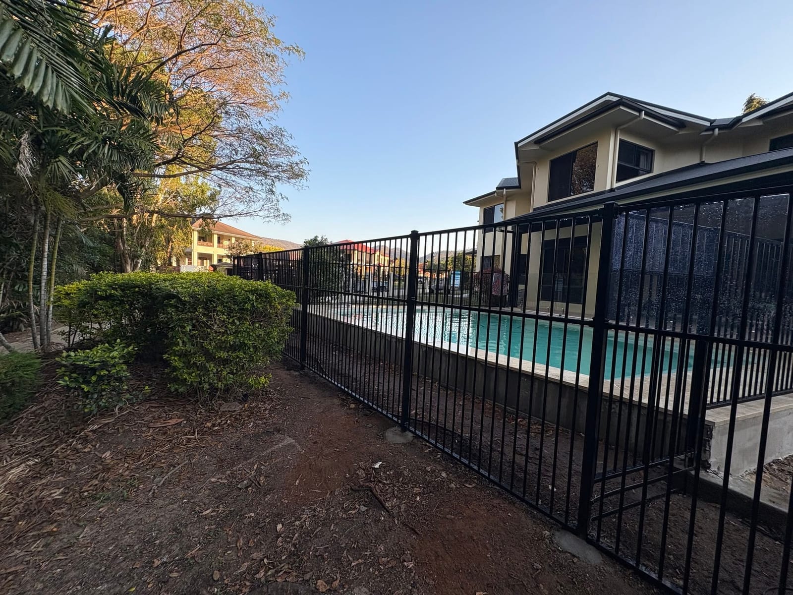 Black tubular aluminium pool fencing in Townsville