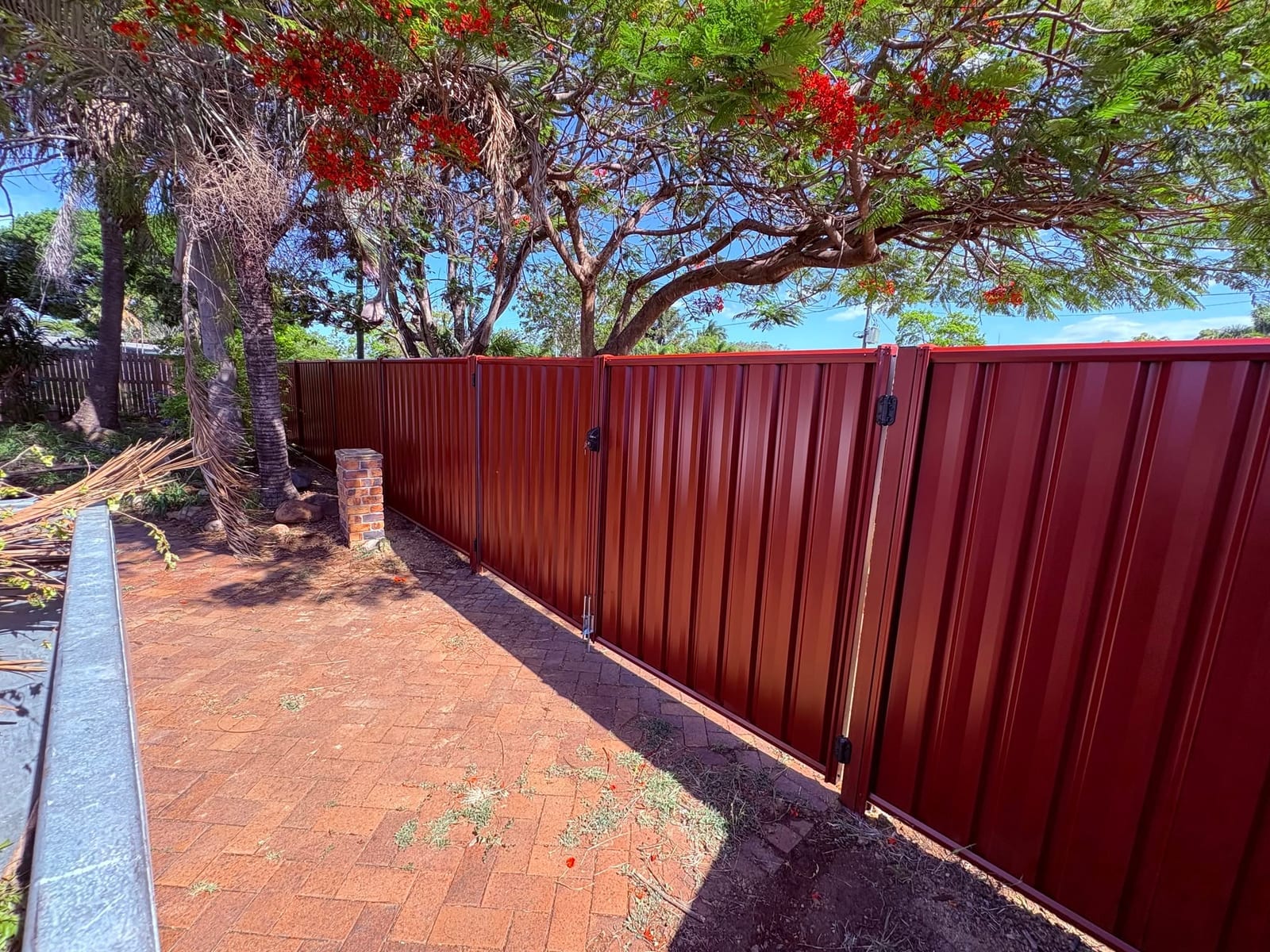 Red Colorbond fencing at a Townsville property