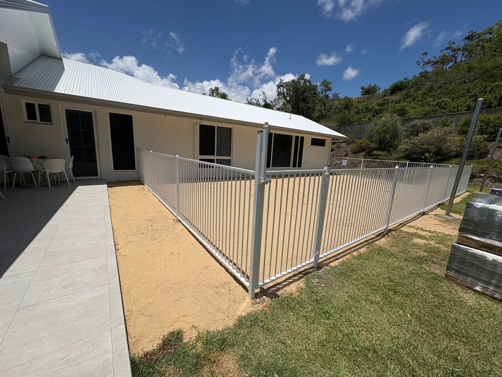 Cream aluminium pool fencing on a new Townsville home