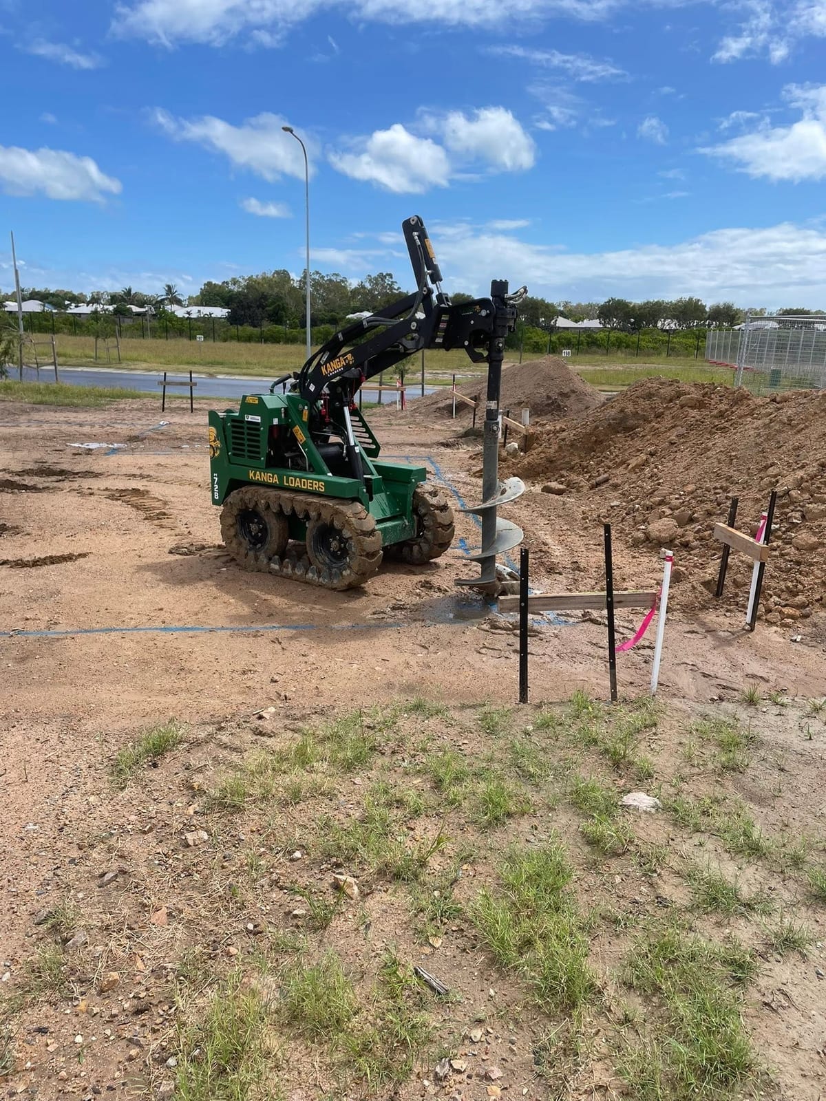 Kanga mini loader augering post holes in Townsville
