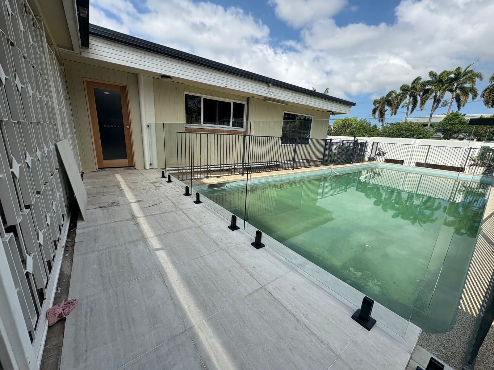 Glass pool fencing around a Townsville pool